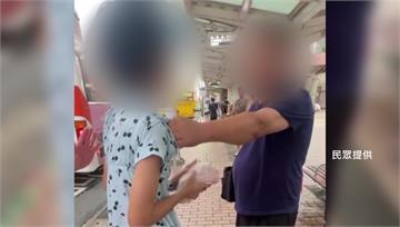 北車公車站驚見家暴現場 男子雨傘毆妻還拖行