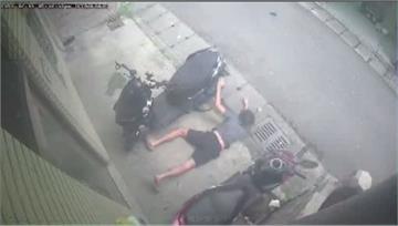 男子墜樓撞破遮雨棚 趴地三秒鐘起身無事離去