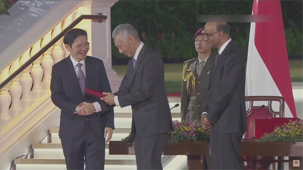 新加坡完成總理交棒，黃循財成為新加坡第四代領導人。圖／畫面攝自AP